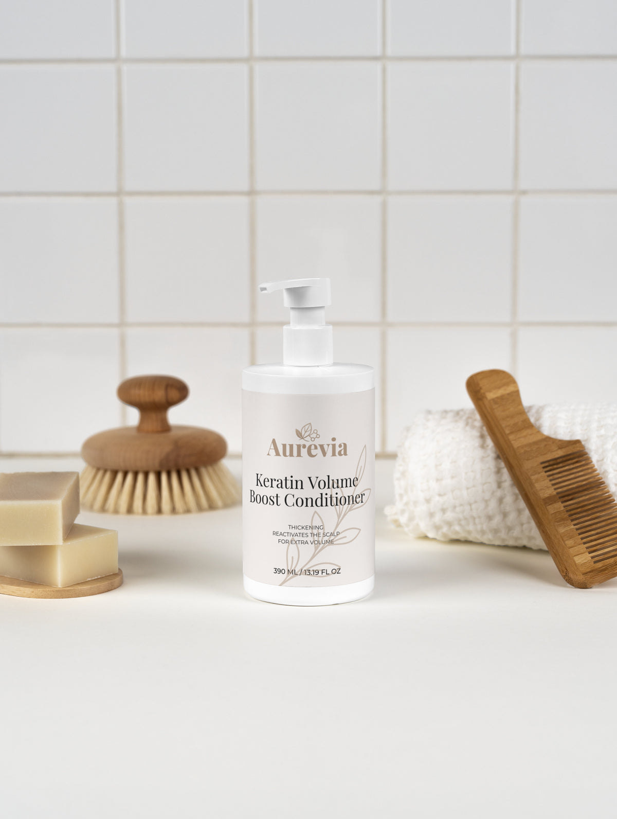 Keratin Volume Boost Conditioner for thickening & scalp reactivation, with wooden brush and soap bars on tiled bathroom counter