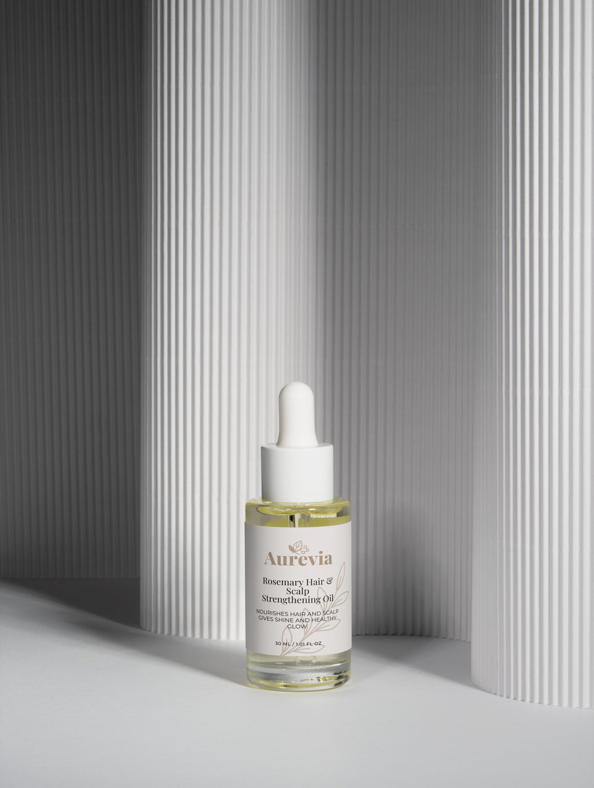 Rosemary Hair & Scalp Strengthening Oil in clear bottle with dropper, nourishes for shine and healthy glow